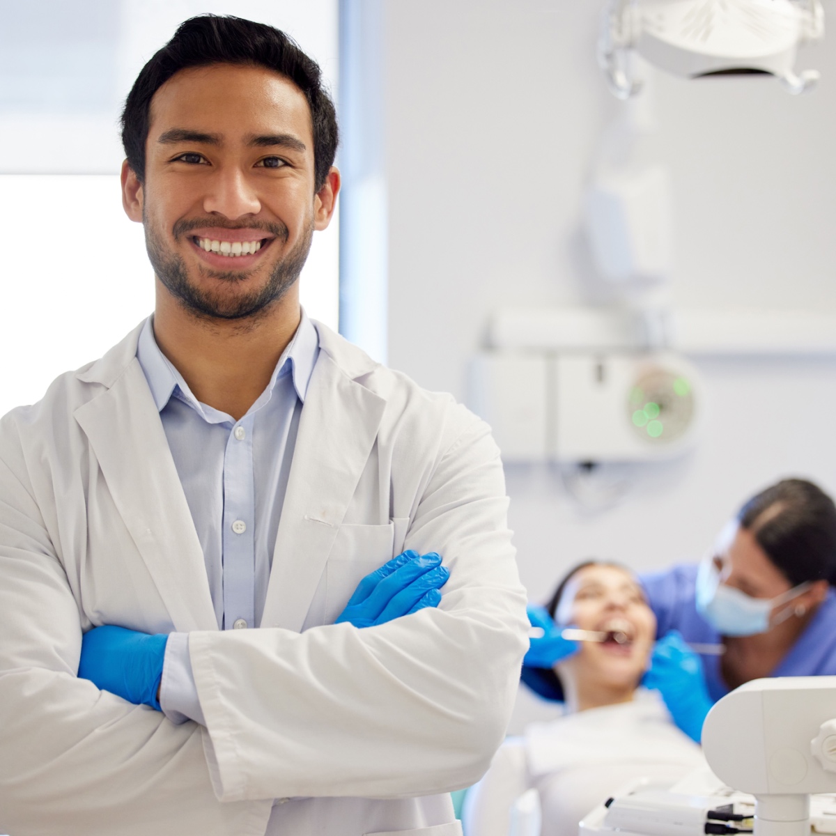 A smiling dentist with his patient